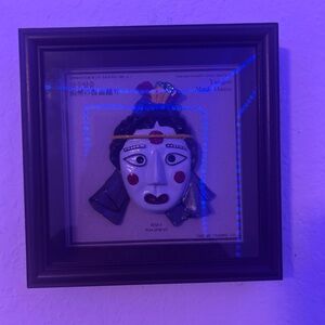Framed Decorative Mask with Red and Blue Accents